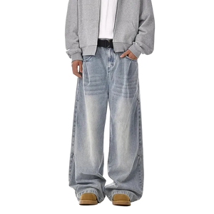 Person wearing a gray jacket and light blue jeans on a white background