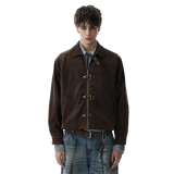 Person wearing a brown jacket with d-ring fastenings on a white background