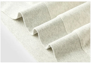 Close-up of beige textured fabric on a white background