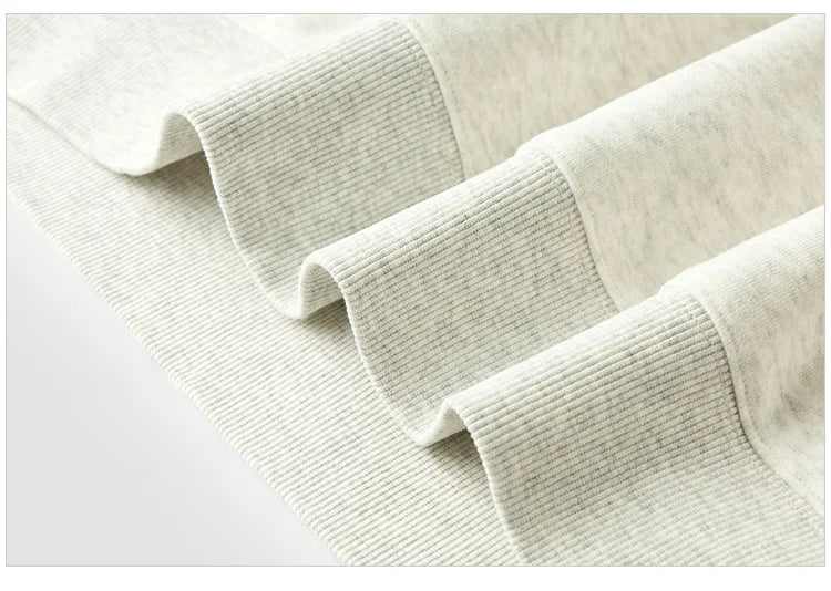 Close-up of beige textured fabric on a white background