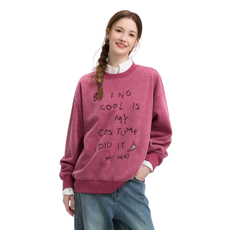 Person wearing a maroon sweater with text on a plain background