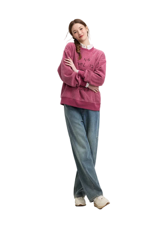 Person wearing a pink sweatshirt and blue jeans on a white background