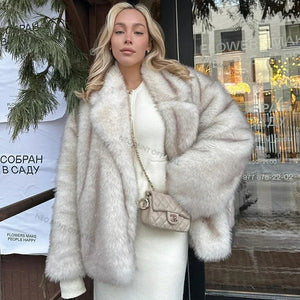 Woman wearing a fur coat with a blurred background