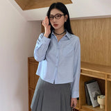 Chemise classique chic à rayures bleues à manches longues pour femme