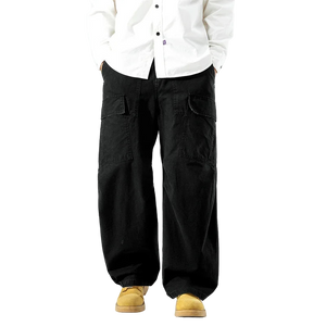 Person wearing black wide-leg pants and a white shirt on a white background