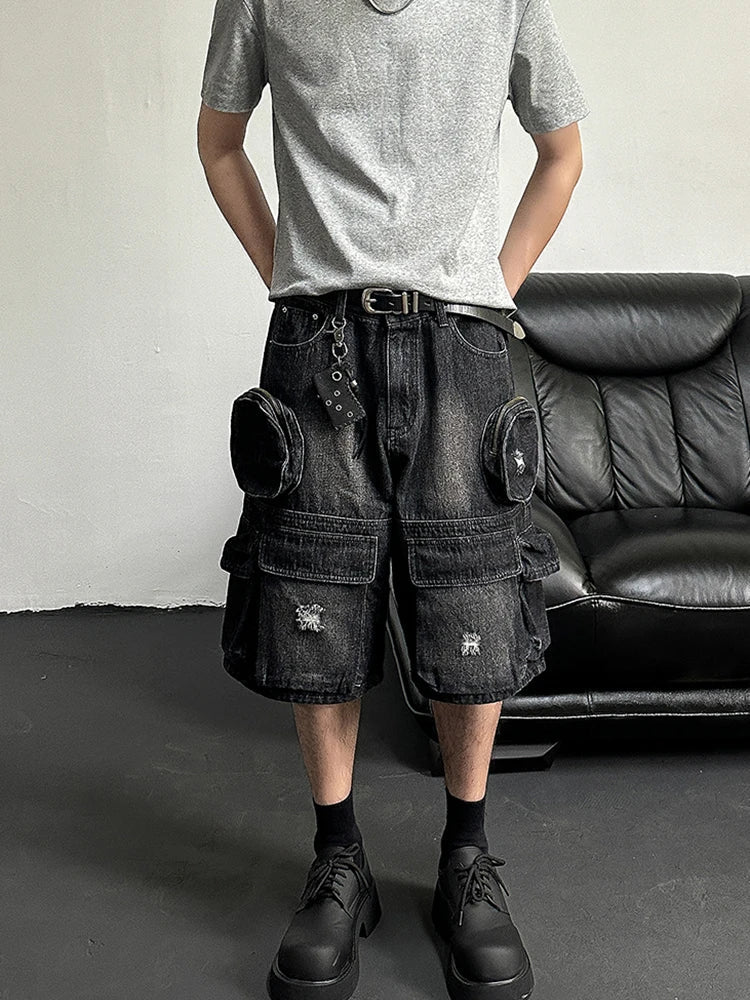 Short en jean noir à jambes larges et déchirées