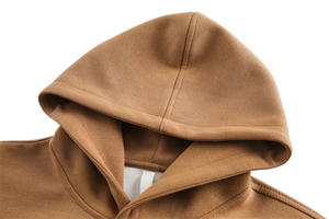 Close-up of a brown hood on a garment against a light background