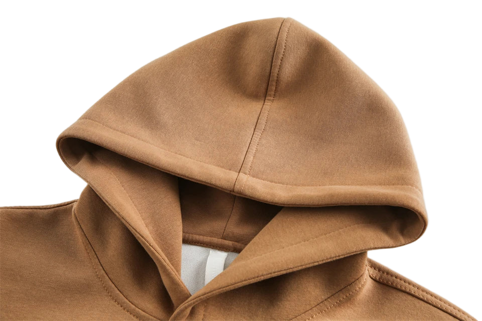 Close-up of a brown hood on a garment against a light background
