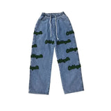 Elastische, hochgeschnittene Jeans mit Flockstickerei
