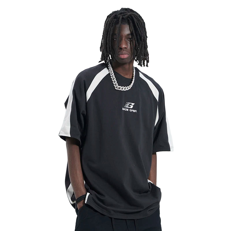 Person wearing a black and white sports jersey with a brand logo on a white background