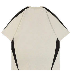 Beige t-shirt with black sleeves on a white background