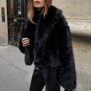 Style yourself in this luxurious black faux fur jacket, designed with an ultra-plush texture and voluminous collar for the ultimate glamorous streetwear statement.