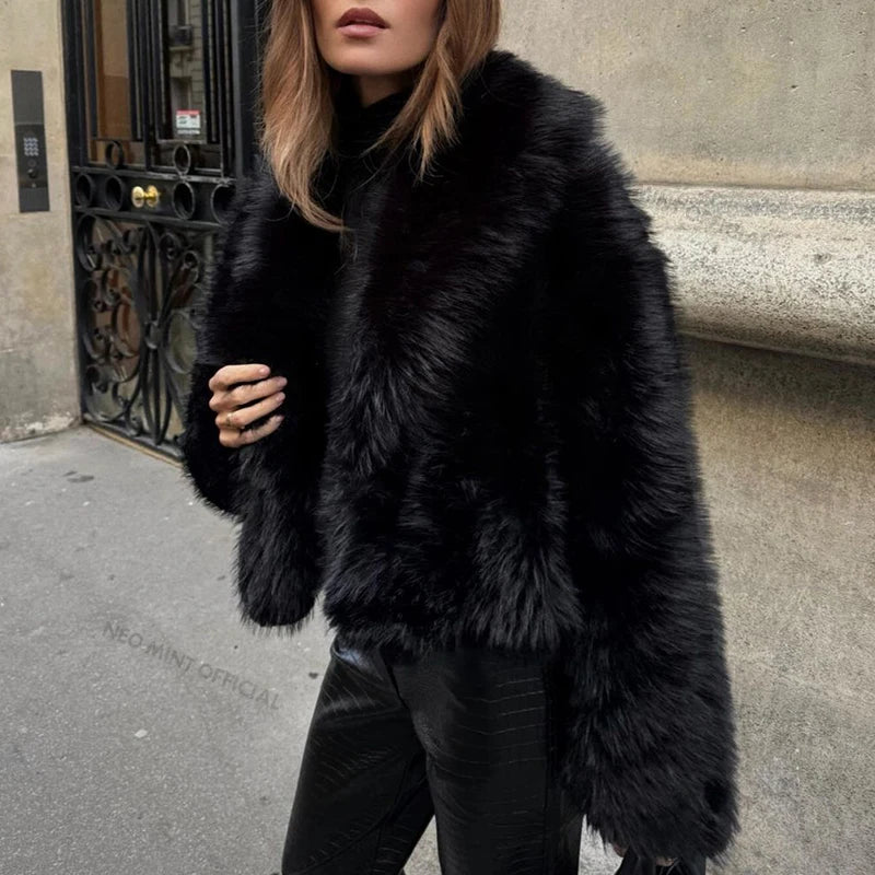Style yourself in this luxurious black faux fur jacket, designed with an ultra-plush texture and voluminous collar for the ultimate glamorous streetwear statement.