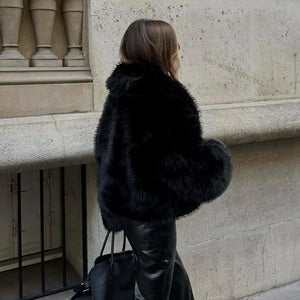 Style yourself in this luxurious black faux fur jacket, designed with an ultra-plush texture and voluminous collar for the ultimate glamorous streetwear statement.
