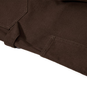Close-up of a brown fabric texture on a white background