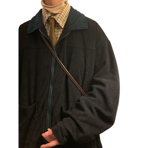 Style yourself in this oversized green corduroy jacket with a contrasting brown collar to add a vintage, textured edge to your daily streetwear rotation.