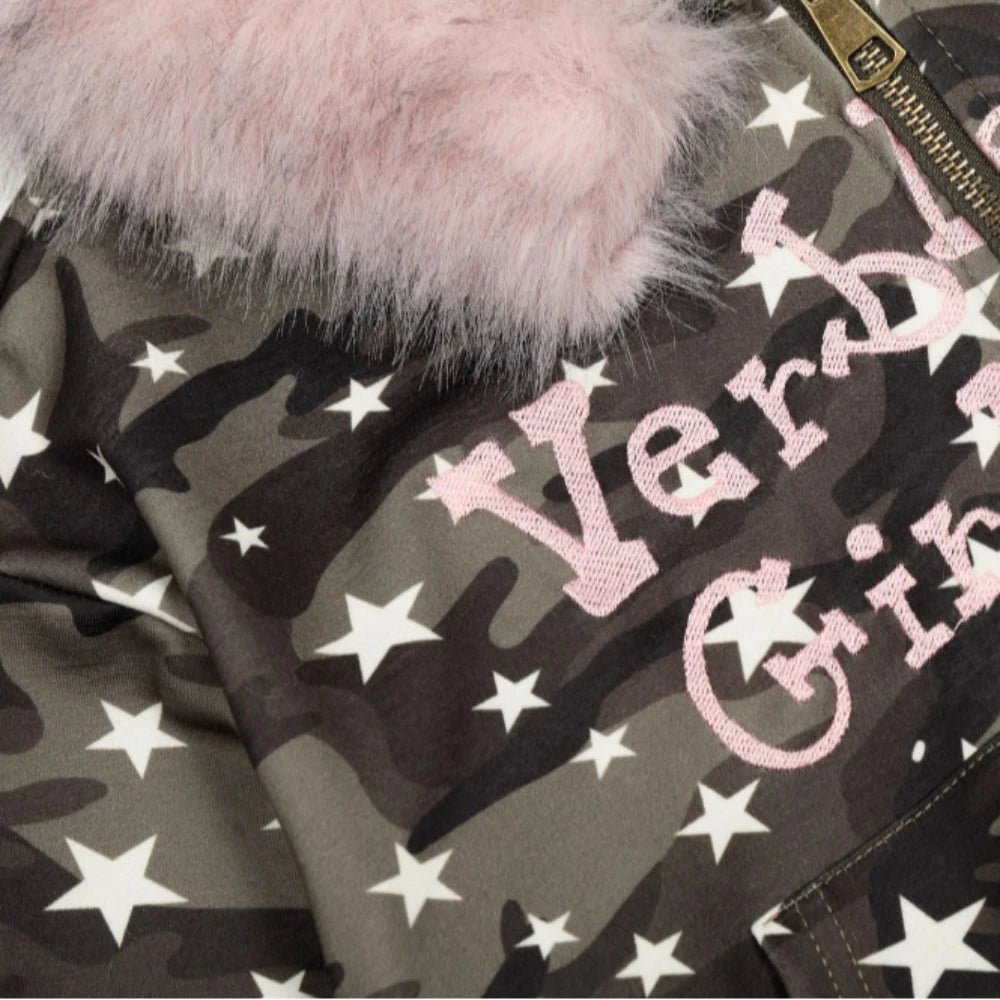 Jacket with pink text and star patterns on a camouflage background