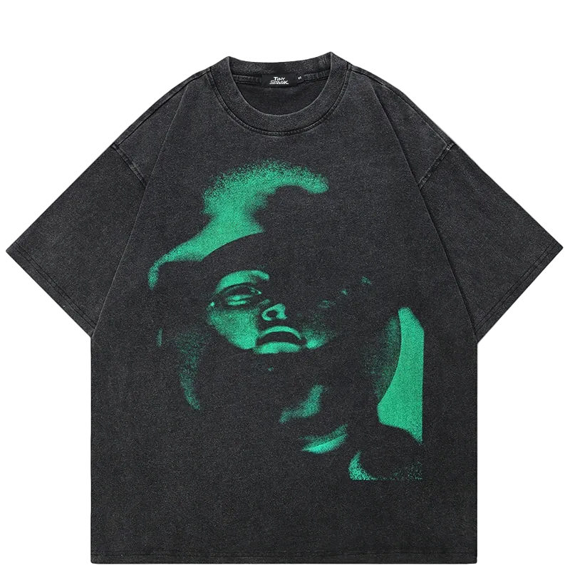 Black t-shirt with green graphic design on a white background