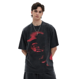 Person wearing a black t-shirt with red graphic design on a white background