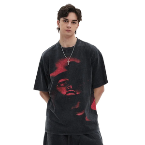 Person wearing a black t-shirt with red graphic design on a white background