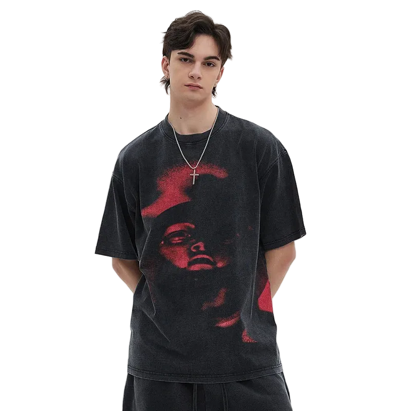 Person wearing a black t-shirt with red graphic design on a white background