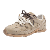 Beige sneaker with white laces on a white background