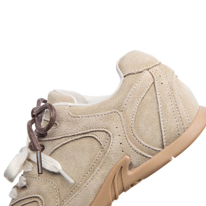 Beige sneaker with white laces on a white background