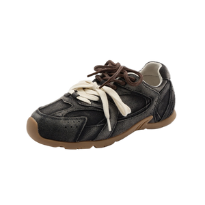 Black sneaker with brown accents on a white background