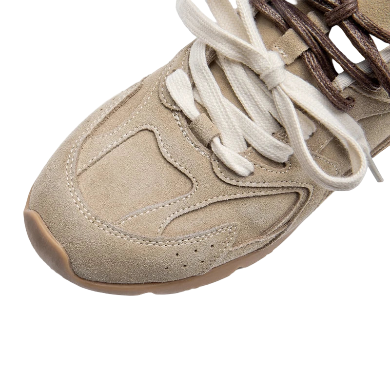Beige sneaker with white laces on a white background
