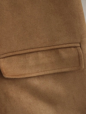 Close-up of a brown fabric pocket on a garment