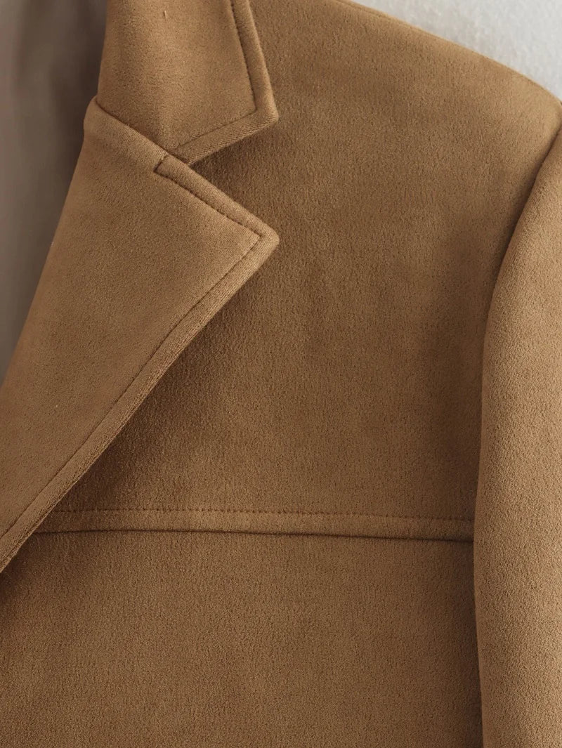 Close-up of a brown coat with a collar