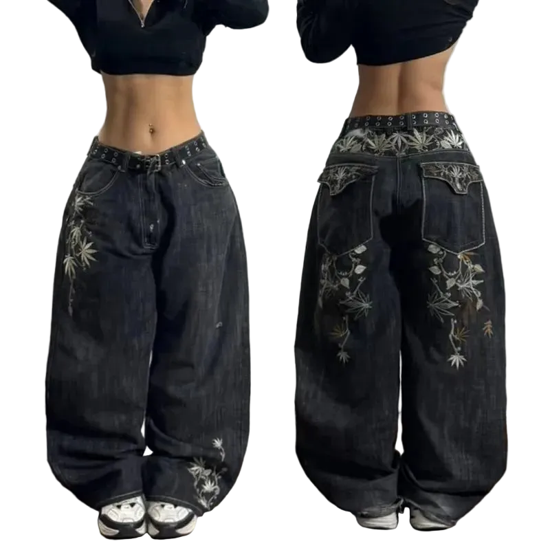 Black wide-leg jeans with floral embroidery on a plain background