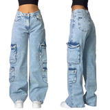 Light blue jeans with patchwork design worn by a person on a gray background