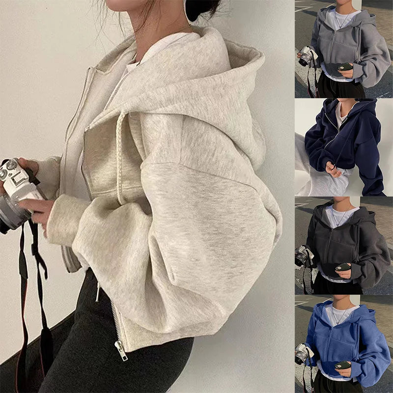 Level up your layers with this ultra-comfy oversized zip-up hoodie featuring a slouchy drop-shoulder fit for the perfect streetwear look.